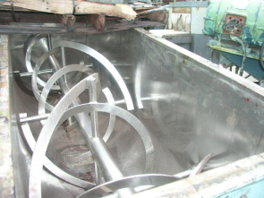 A large metal machine with many wheels on it