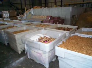 A warehouse filled with lots of white containers.